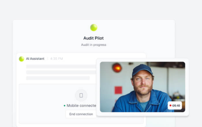 A computer screen shows an "Audit Pilot" status with audit in progress, alongside a video call window displaying a man in a blue shirt and cap.