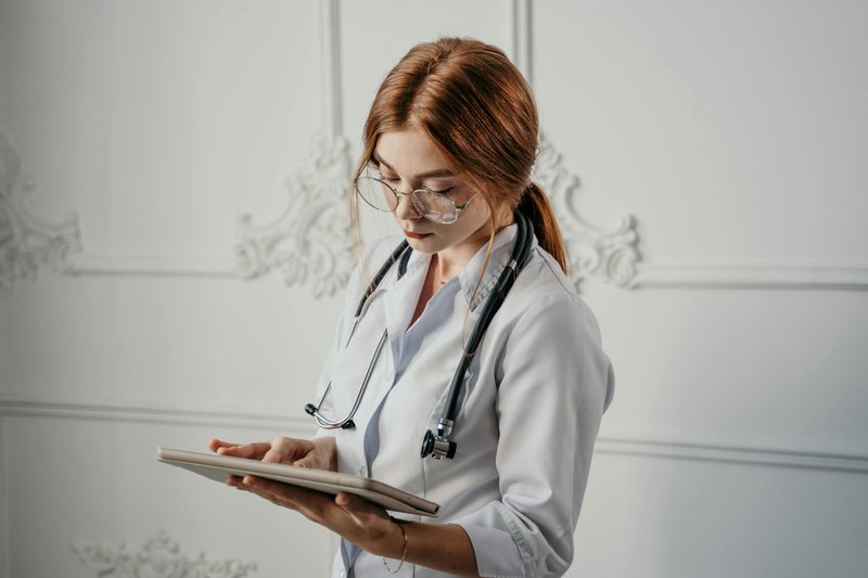 Healthcare professional using tablet for modern care management